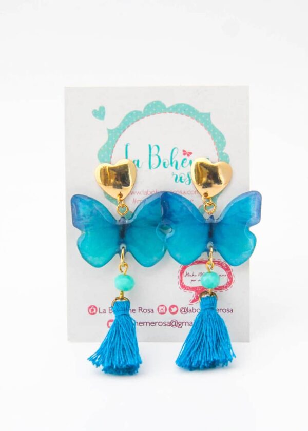 Zarcillo Adele de mariposas azul largos con pompon